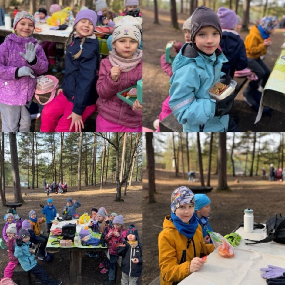 Kolāža attēlo priecīgu bērnu grupu siltās drēbēs, kas mežā sēž pie koka galdiem un ēd uzkodas. Daži bērni smaida, turot rokās vafeles vai sviestmaizes.